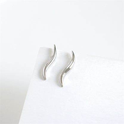 Silver wavy vine climber stud earrings, side view with curved wave detail