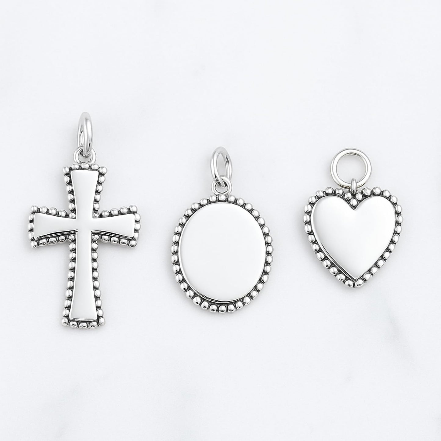 Heart charm pendant with beaded border and ring loop, silver tone