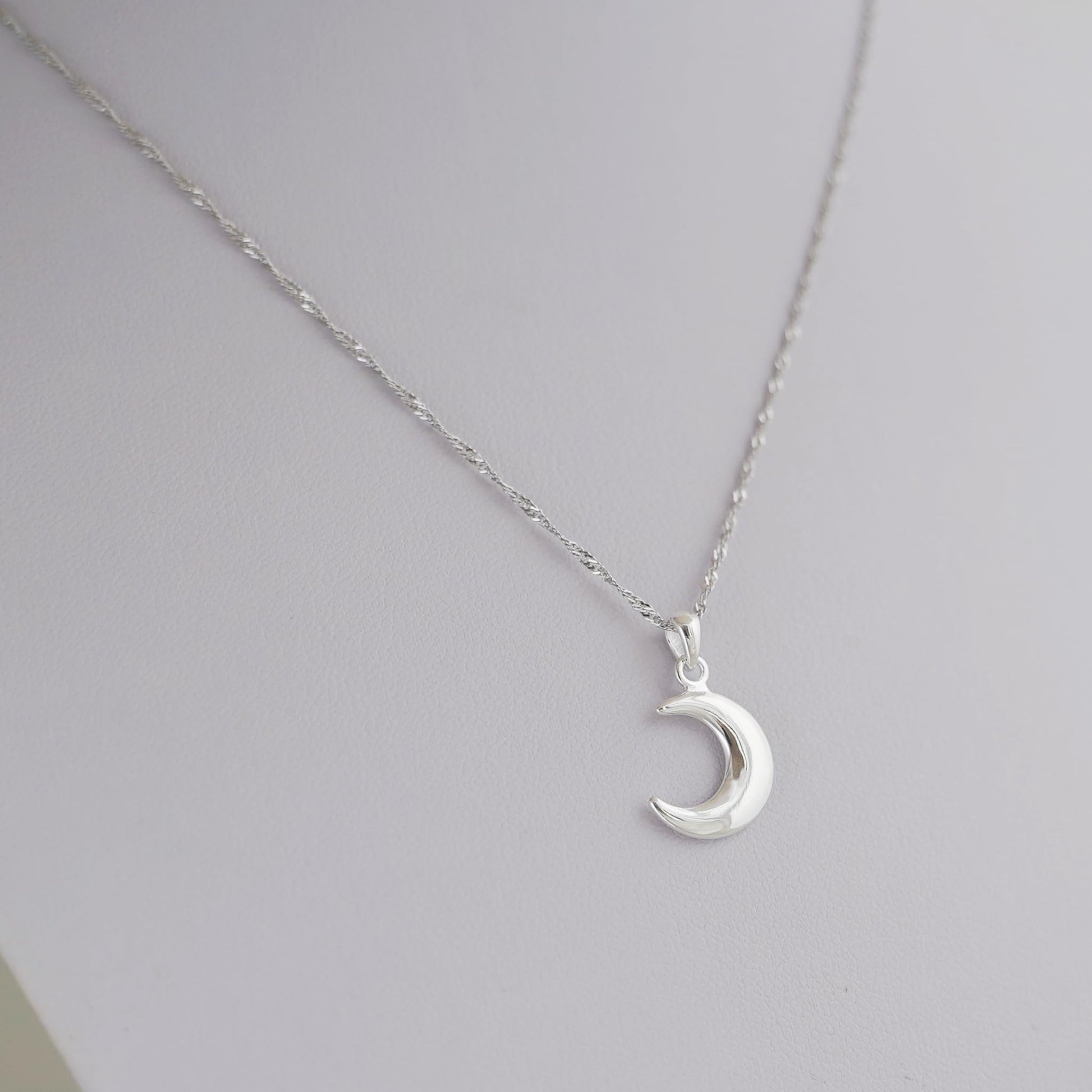 Rhodium twisted chain necklace with crescent moon pendant