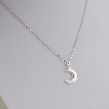 Rhodium twisted chain necklace with crescent moon pendant