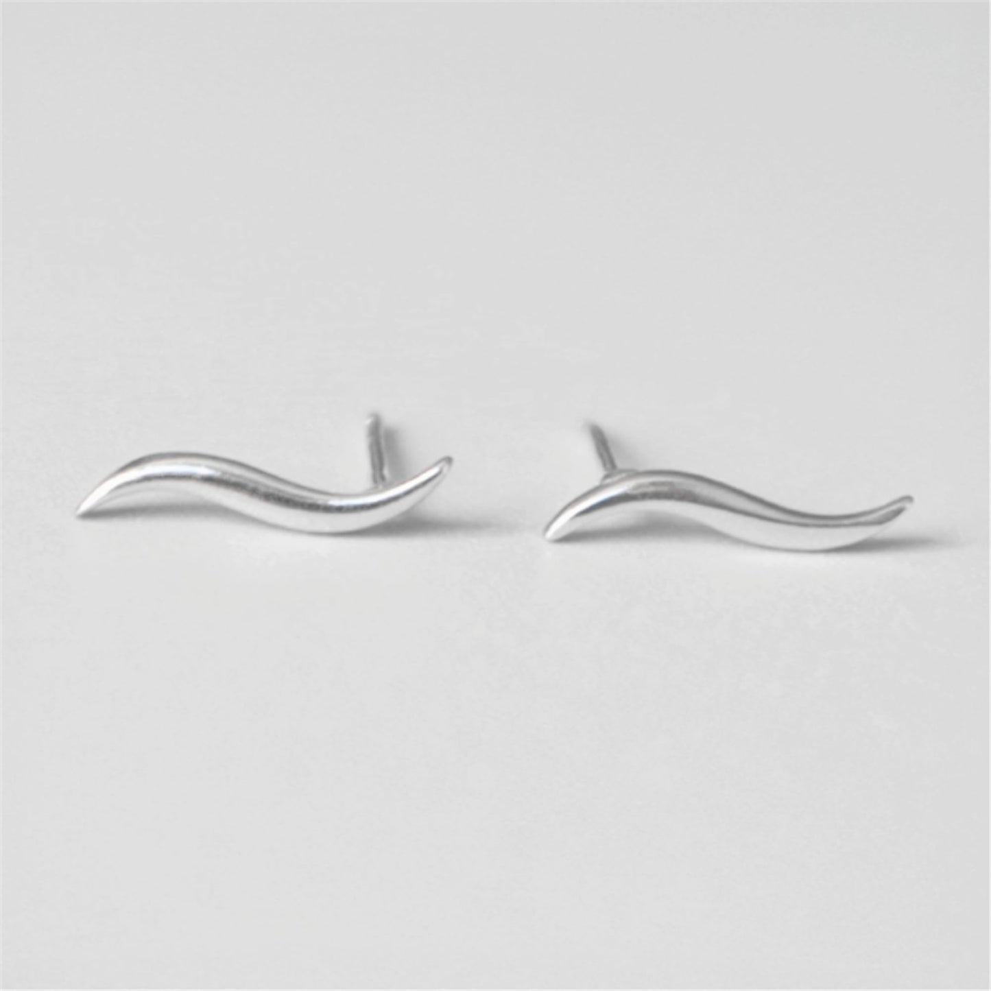 Silver wavy vine climber stud earrings, front view with wavy vine shape