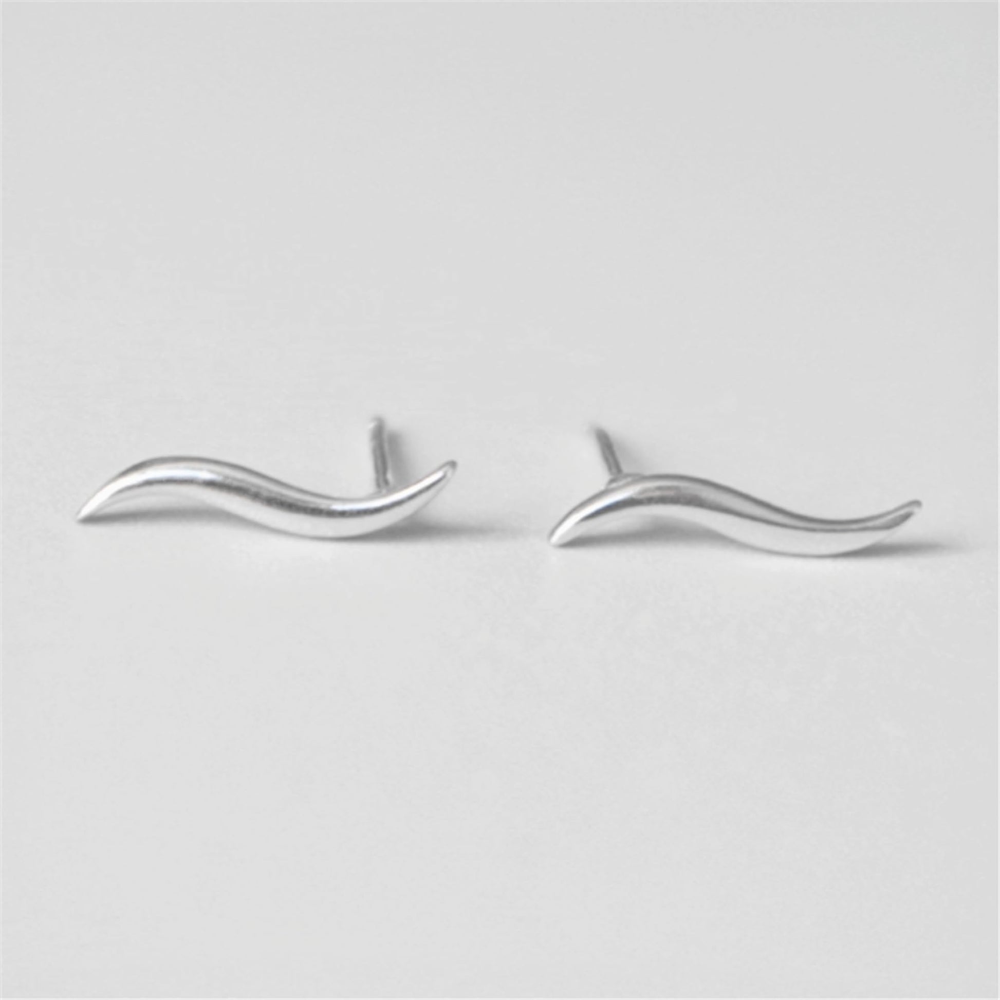 Silver wavy vine climber stud earrings, front view with wavy vine shape