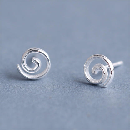 Silver spiral swirl stud earrings, small round backs with curled swirl detail.