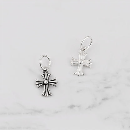 Fleur-de-lis cross charm hook earrings in plain silver, two views