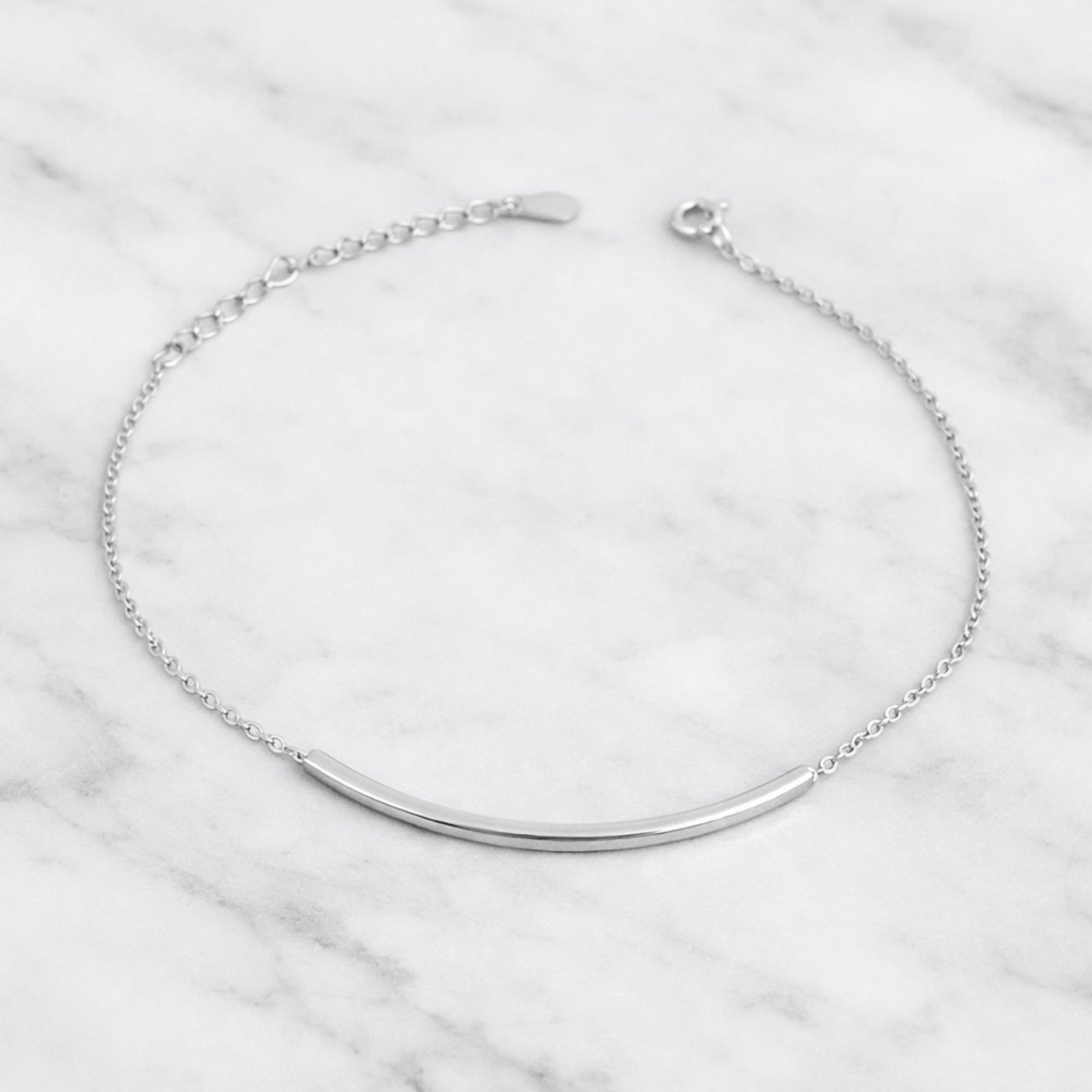 Silver curb chain anklet with curved tube bar and toggle clasp