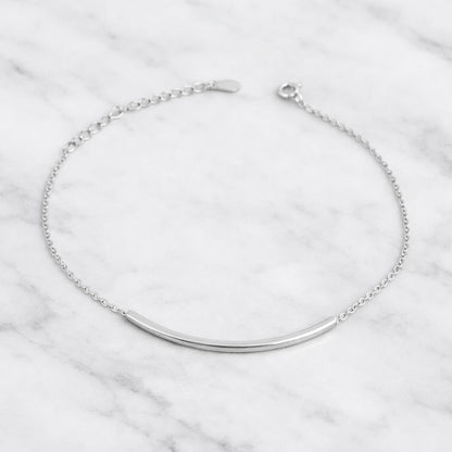 Silver curb chain anklet with curved tube bar and toggle clasp