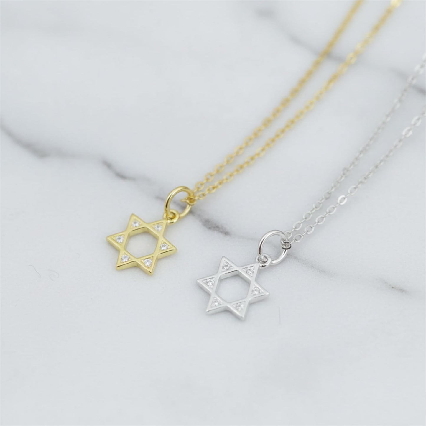 Star of David pendant necklace pair with gold and silver-tone chains and hexagram charms