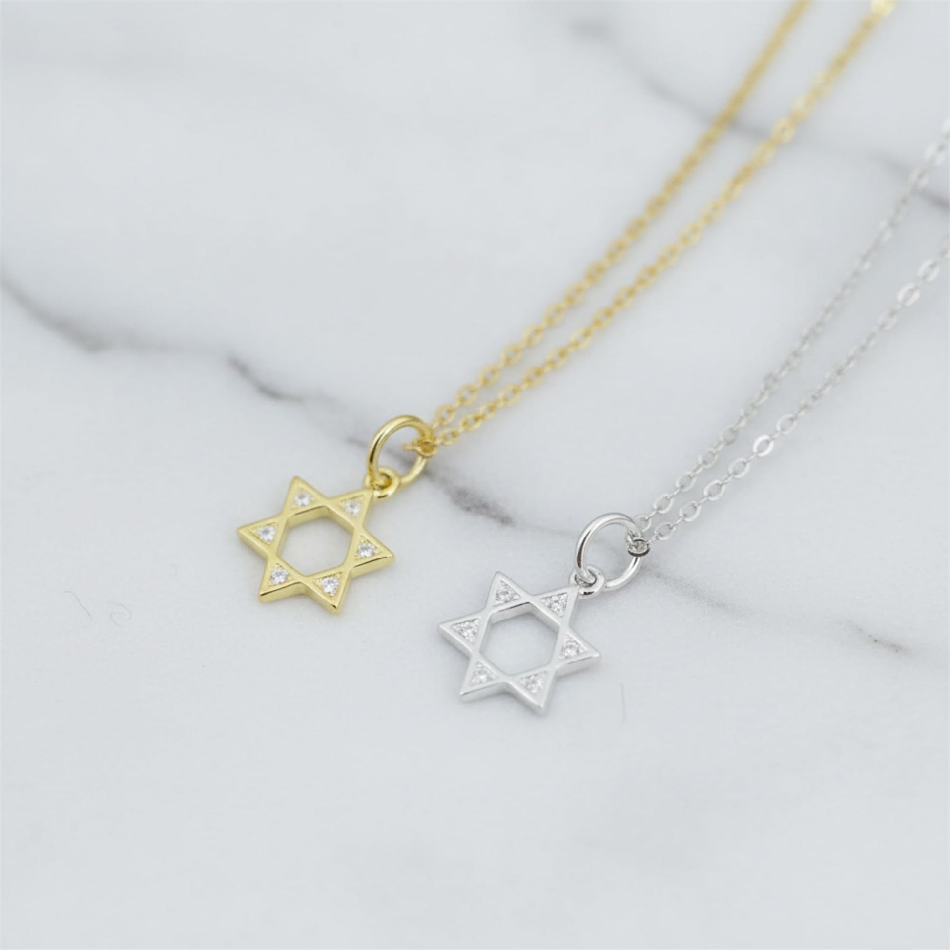 Star of David pendant necklace pair with gold and silver-tone chains and hexagram charms