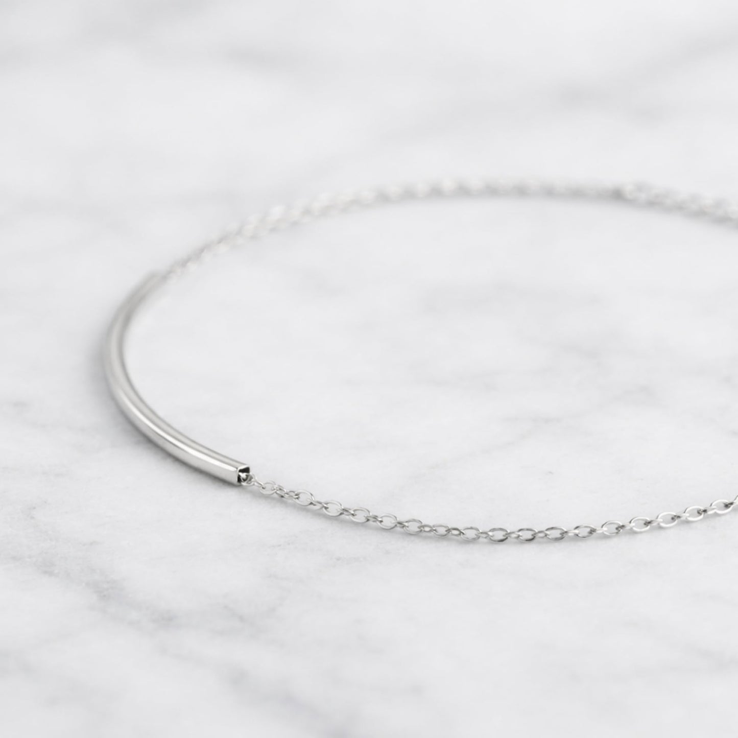 Silver anklet with fine curb chain and small end clasp