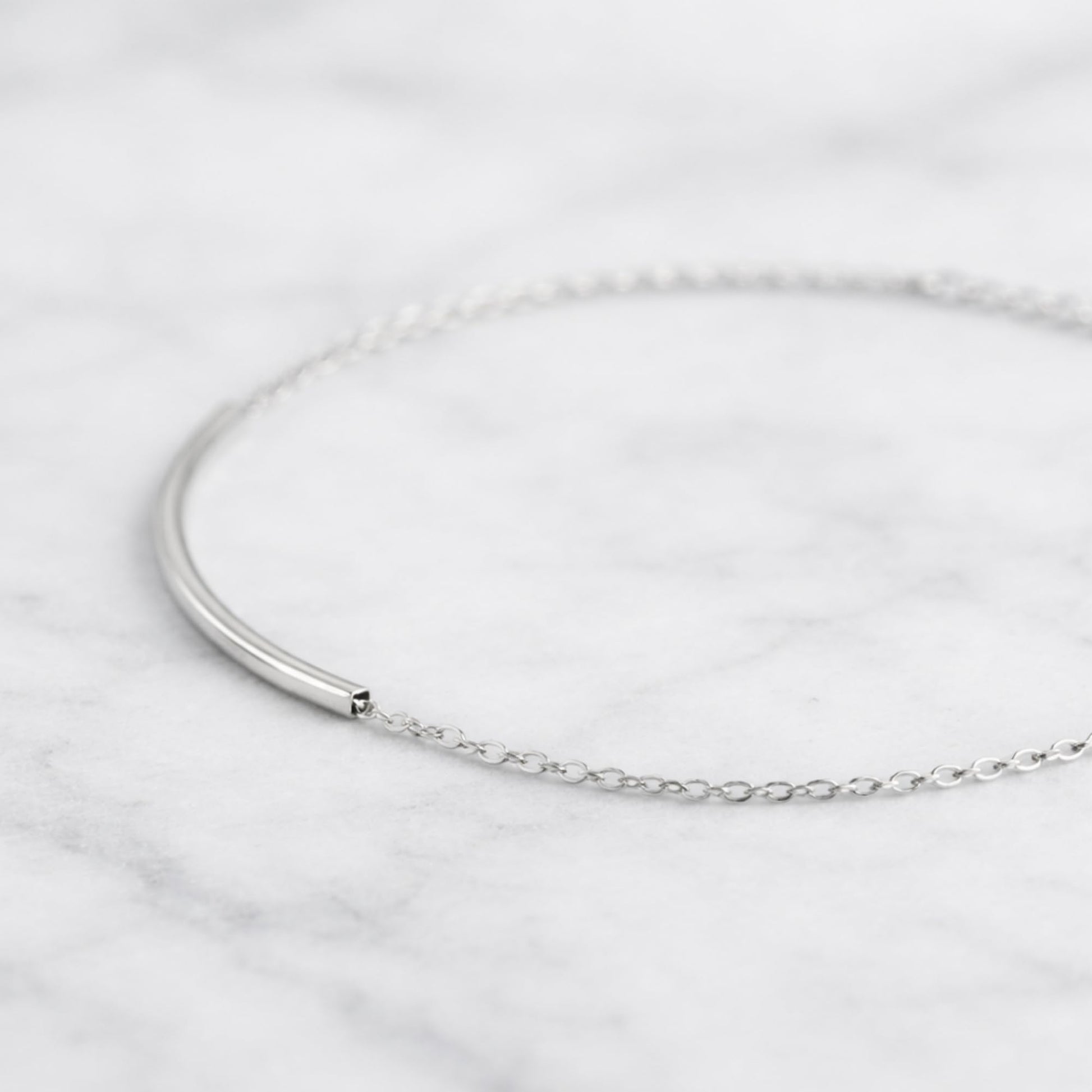 Silver anklet with fine curb chain and small end clasp