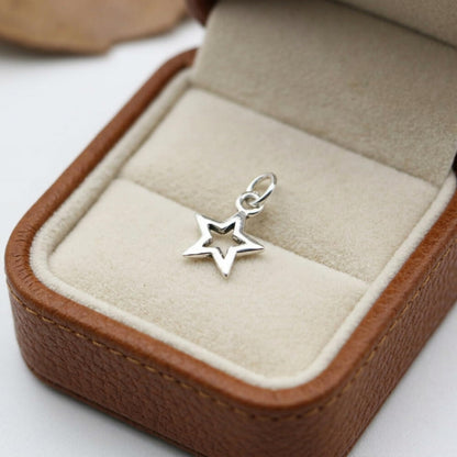 Hollow Lucky Star Charm: small star pendant on a circular ring bail