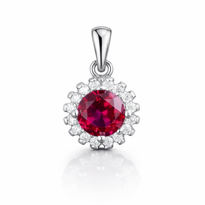 Silver pendant with round red gemstone cluster surrounded by clear stones
