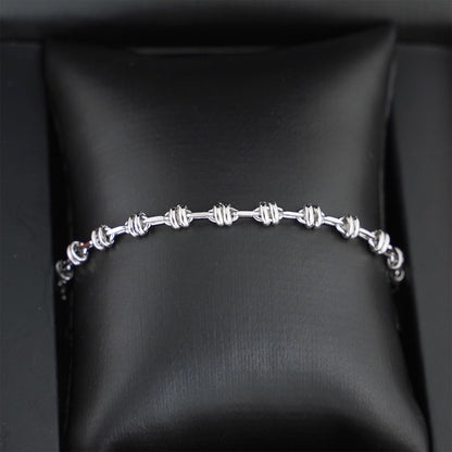 Silver-tone rope curb chain bracelet on black box lining, oval links and clasp