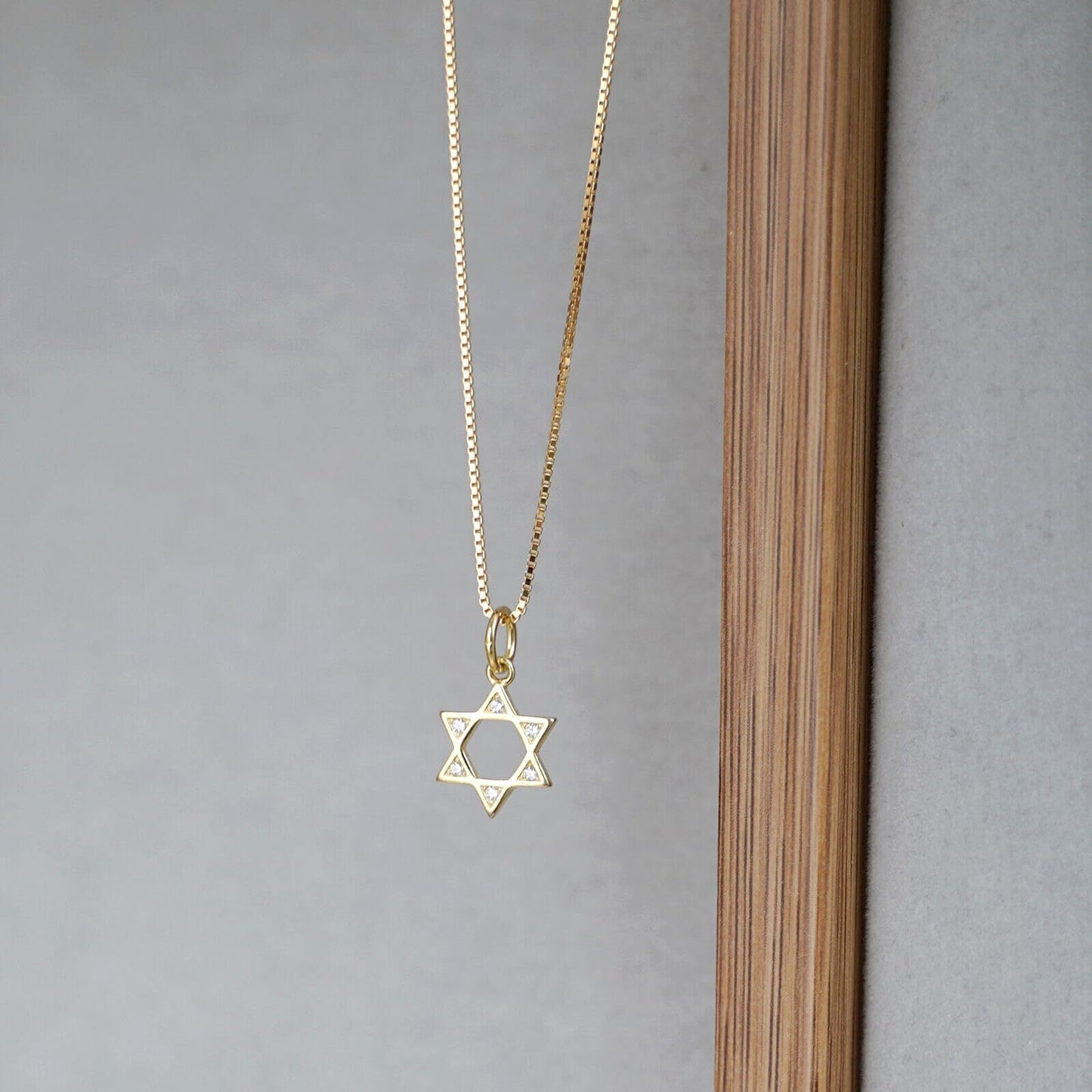 Gold-tone box chain necklace with star of David pendant