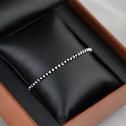 Silver-tone flat bead bracelet in box, beaded links and clasp end
