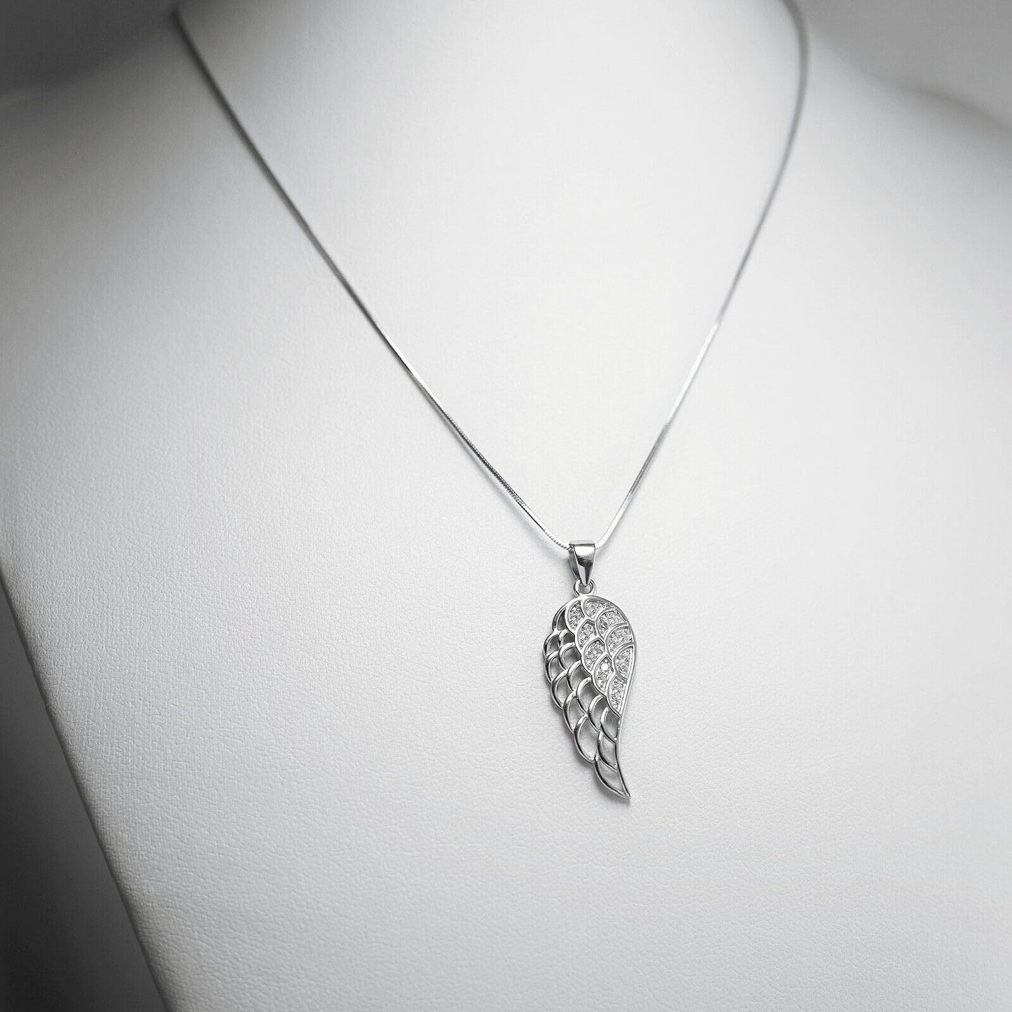 Silver snake chain necklace with wing-style leaf charm pendant
