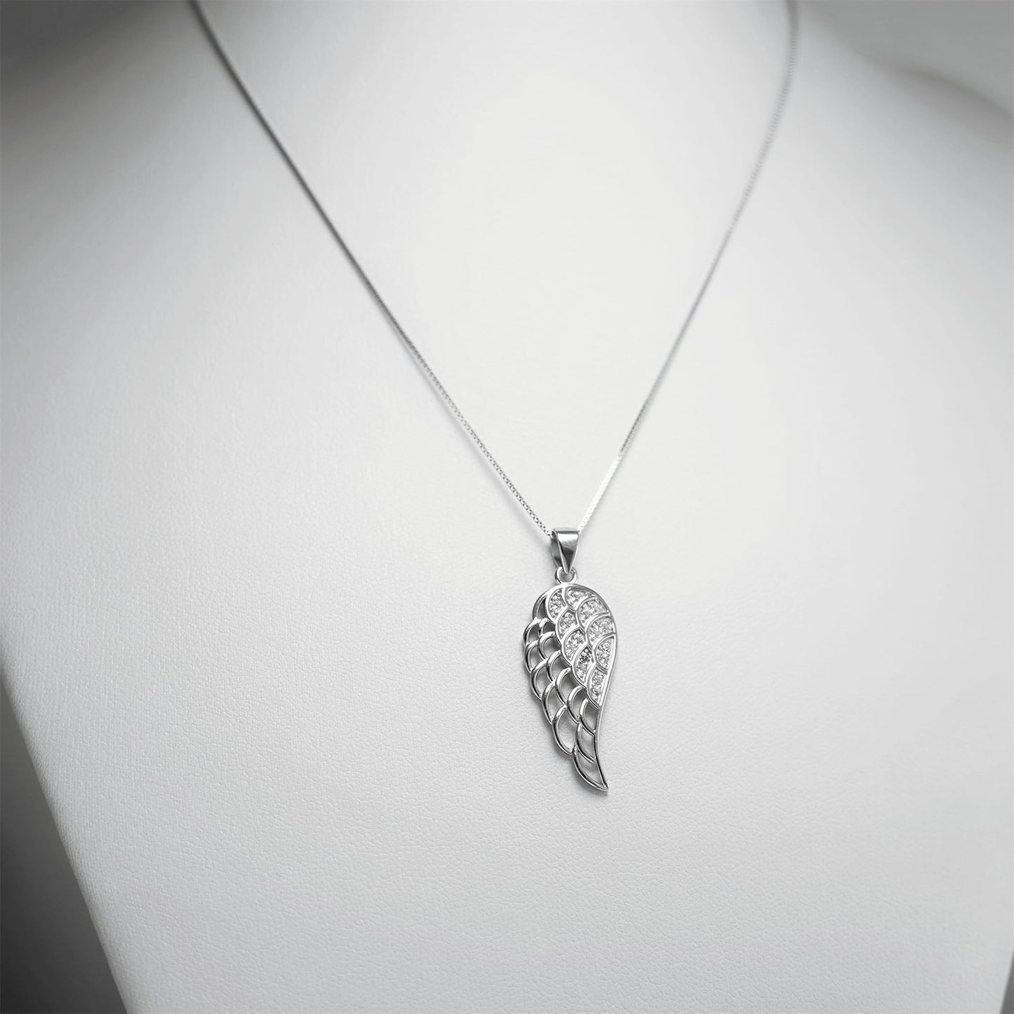 Rhodium-tone box chain necklace with leaf charm pendant at center