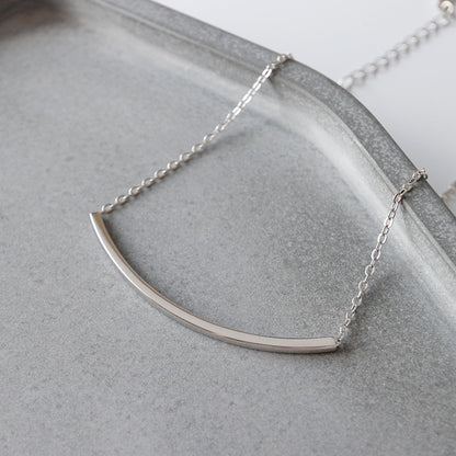 Silver curved tube bar anklet on curb chain