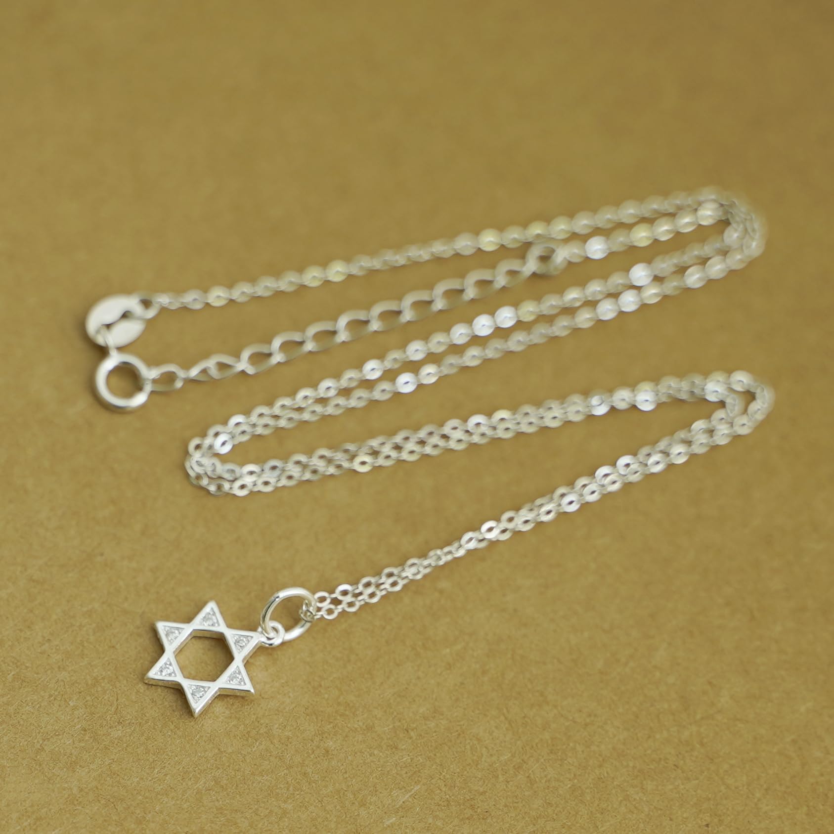 Silver-tone mixed link chain necklace with Star of David charm