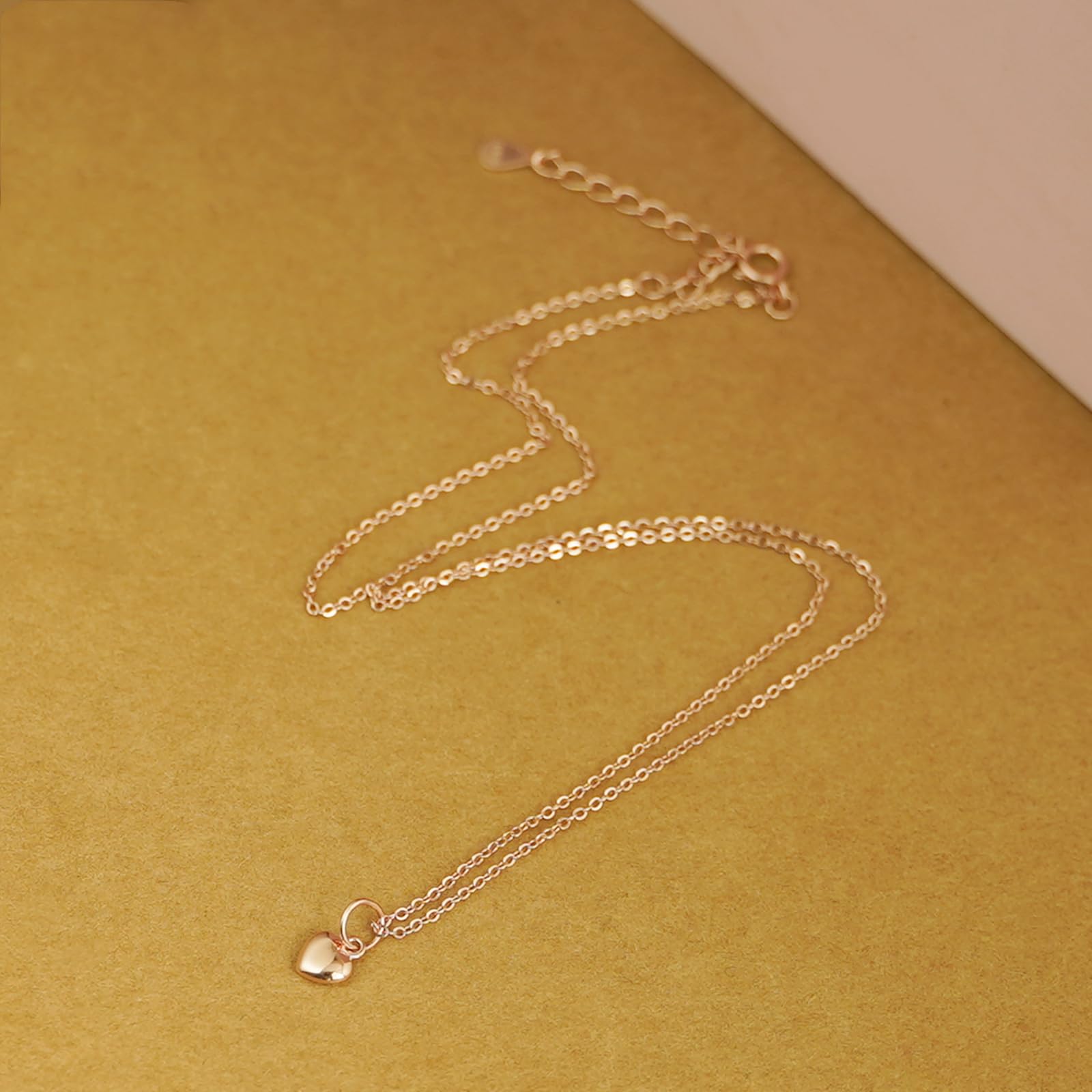 Rose gold-tone mixed link chain necklace with small heart charm