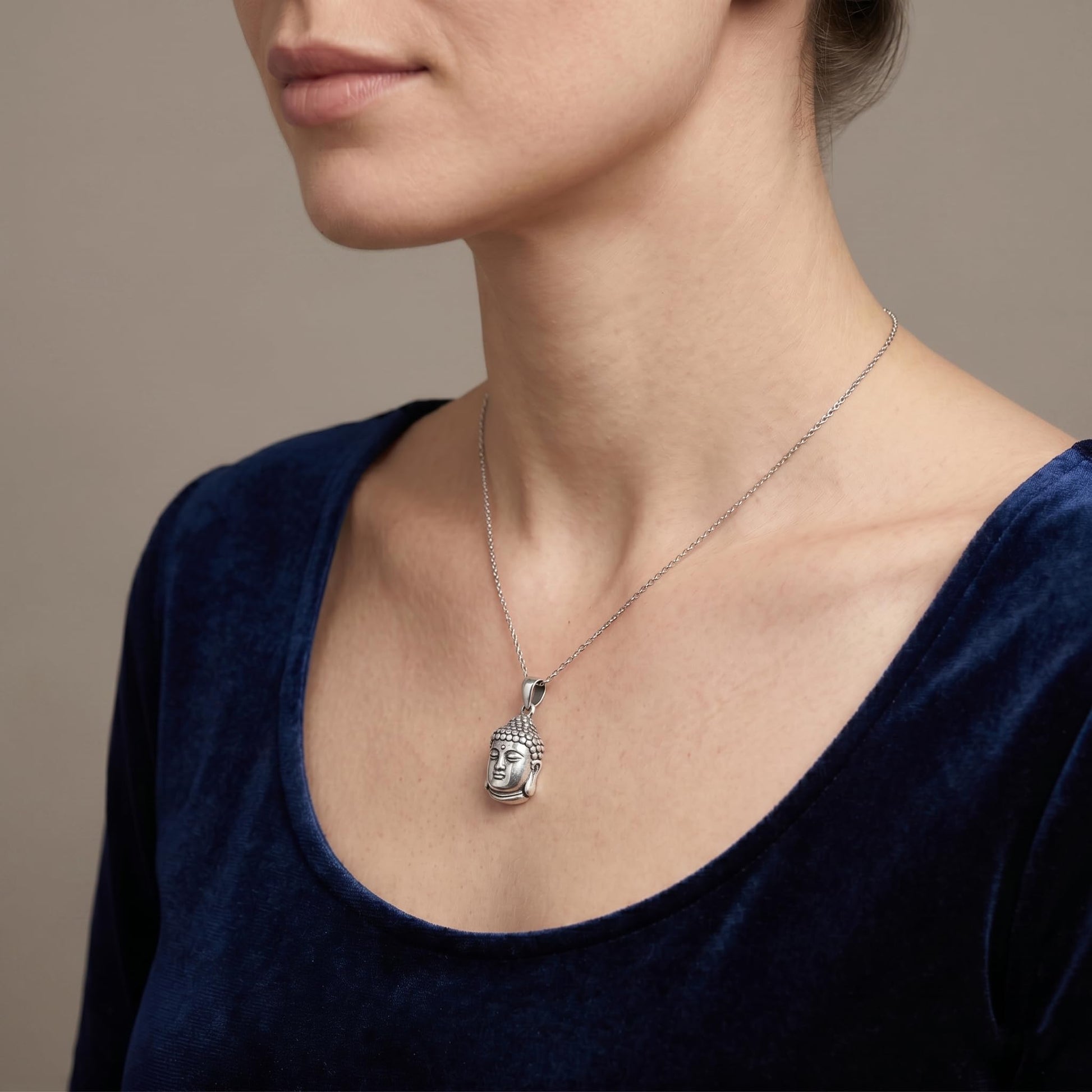 Buddha head pendant on chain necklace, front view, silver-tone