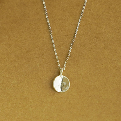 Rhodium curb belcher chain necklace with round pendant, silver tone.