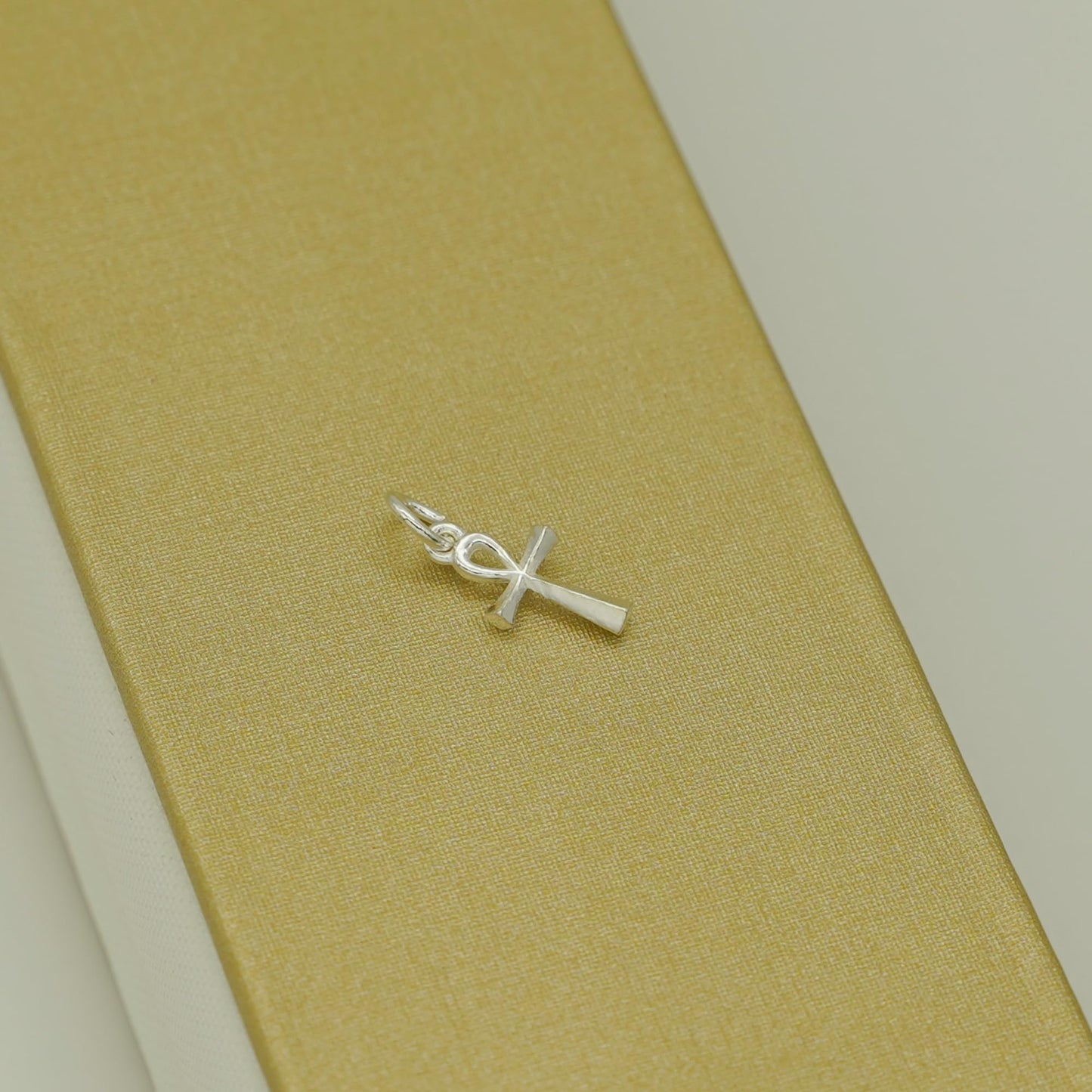 Ankh cross pendant with loop and chain connector, silver-tone metal