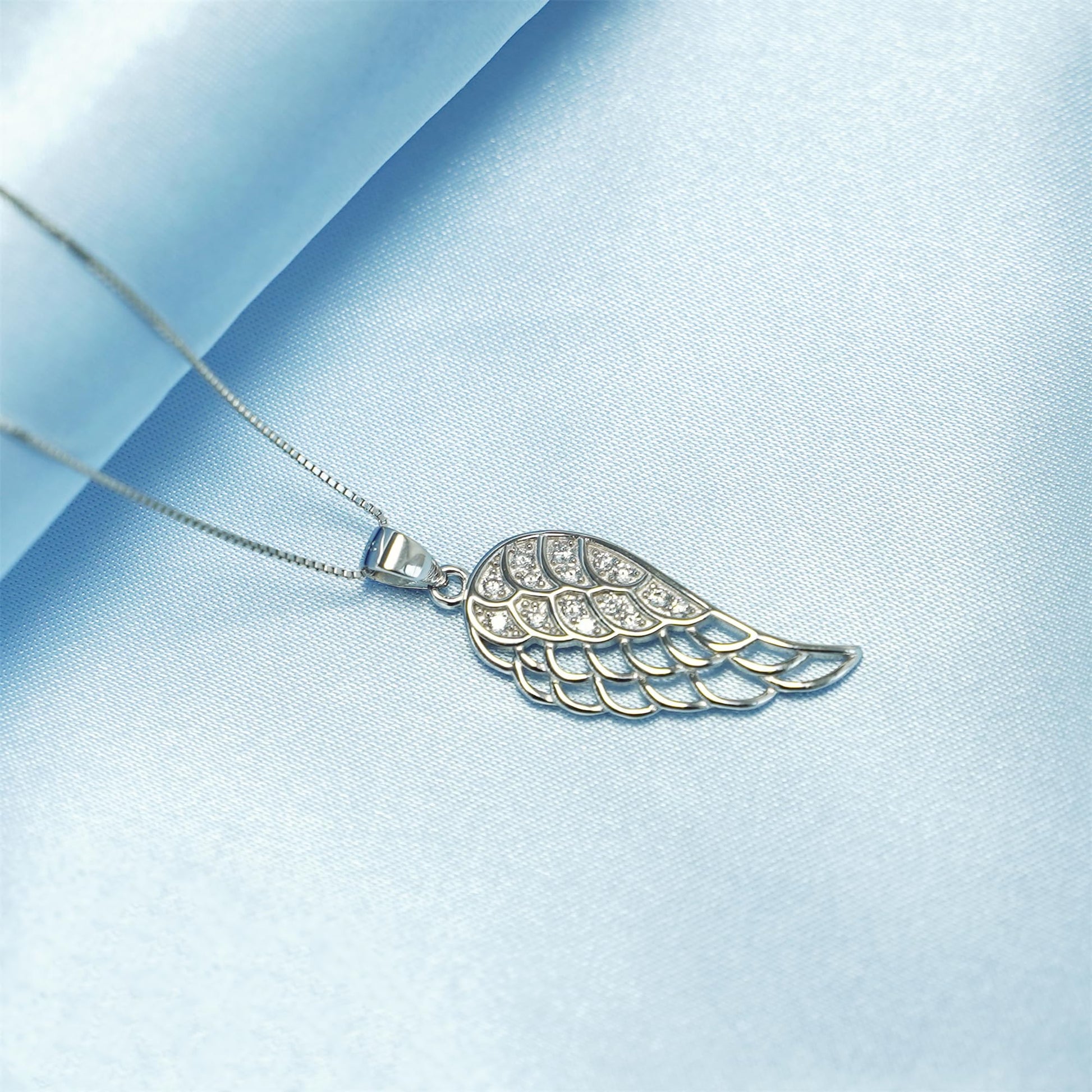 Rhodium-tone box chain necklace with wing-shaped charm pendant
