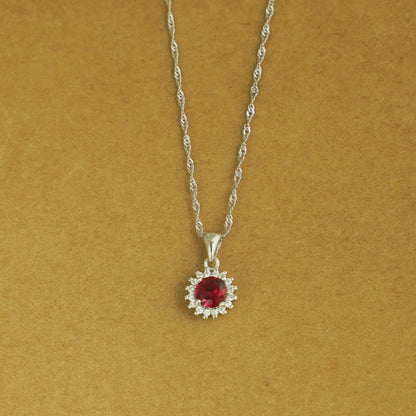 Rhodium twisted chain necklace with round red gemstone halo pendant