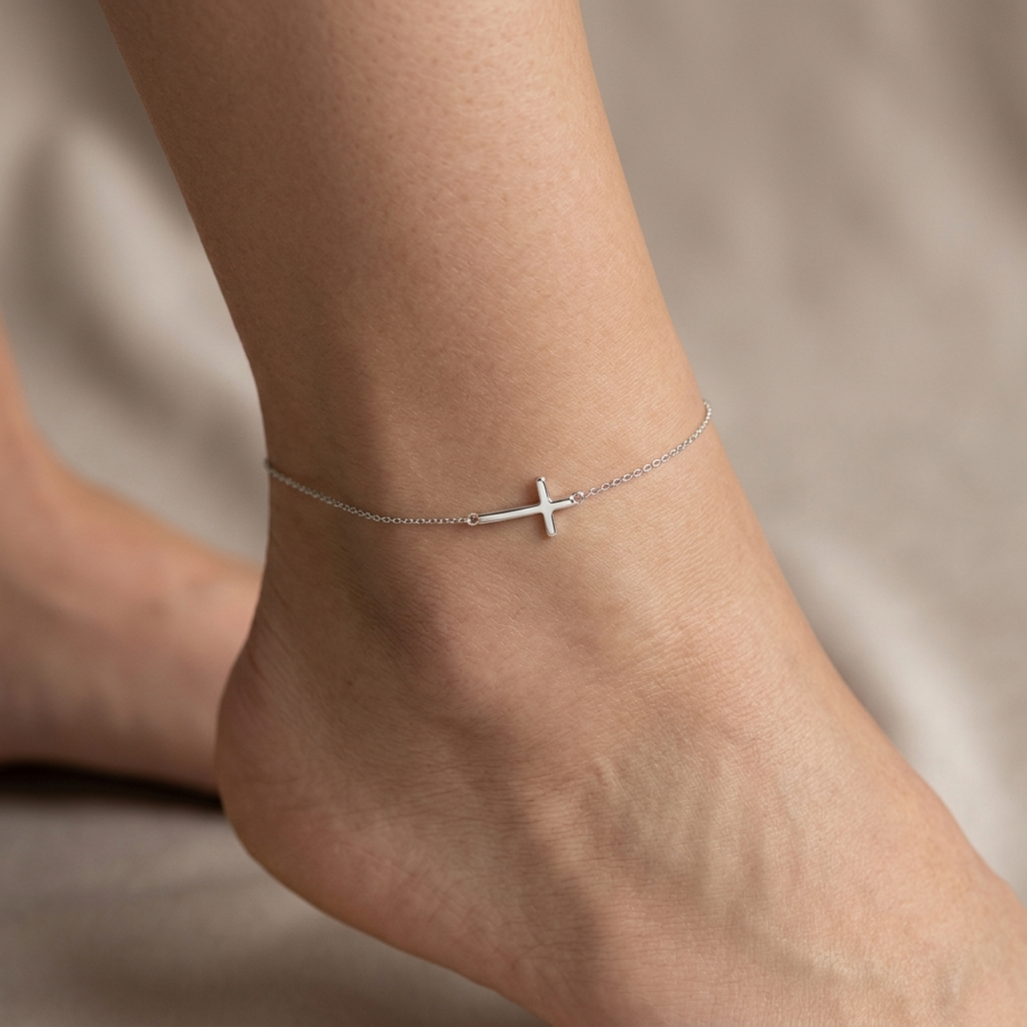 Silver cross anklet bracelet with sideways cross pendant on a fine chain