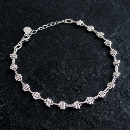Silver-tone rope curb bracelet with oval links and round clasp at one end