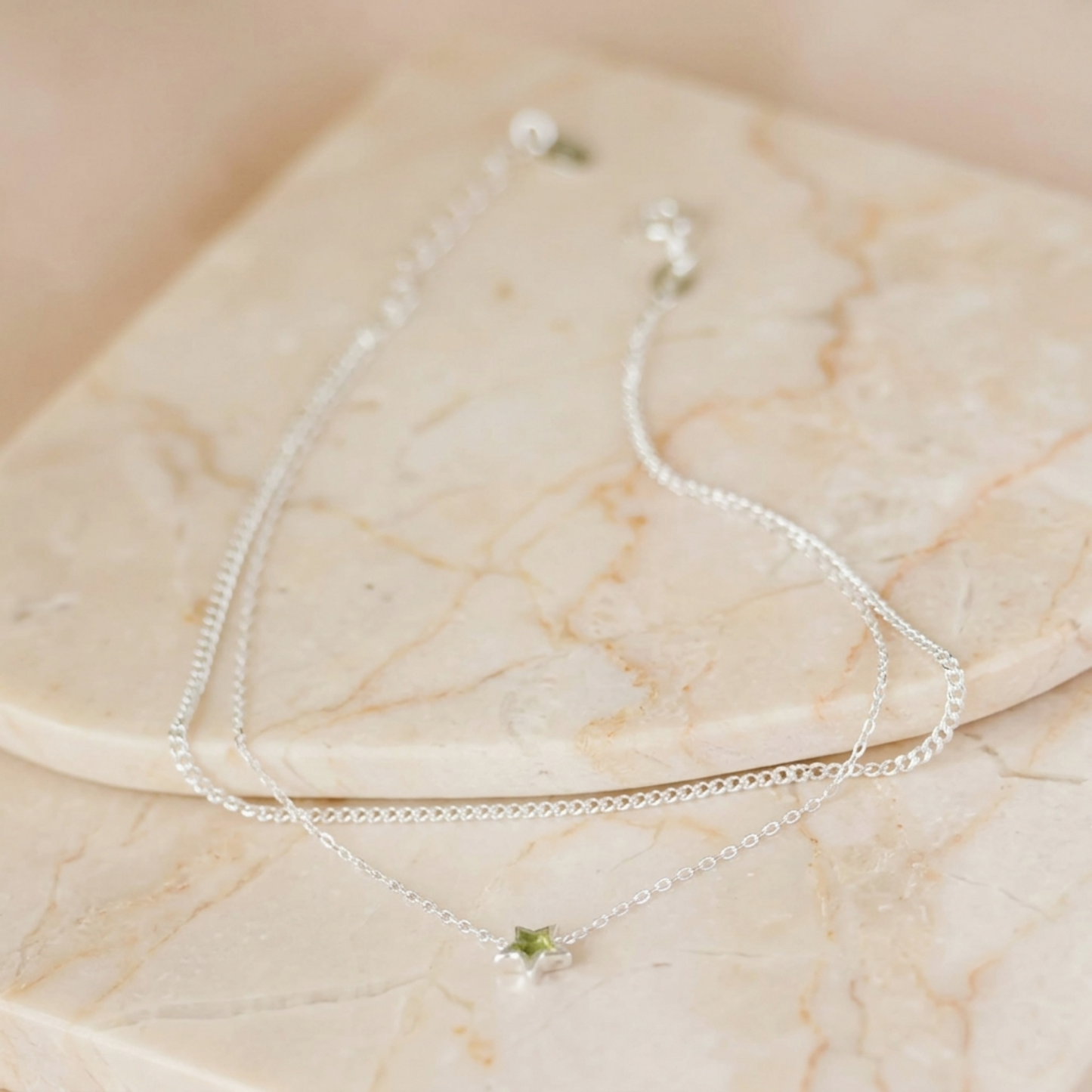 Silver anklet with two chain layers and small star charms, adjustable length