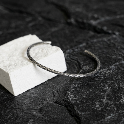 Snake-knot cuff bangle, silver-toned braided wire loop with textured pattern