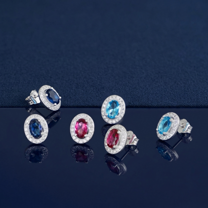 Oval halo CZ stud earrings with blue and red/pink oval stones and stud backs