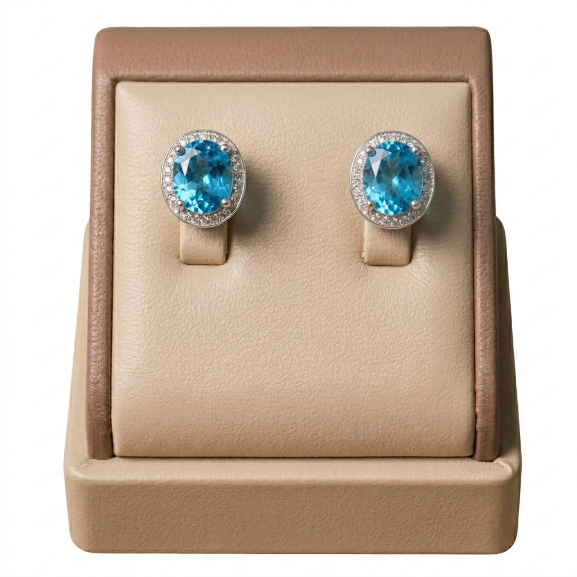 Pair of round blue gemstone stud earrings with CZ halo bezels, silver-tone