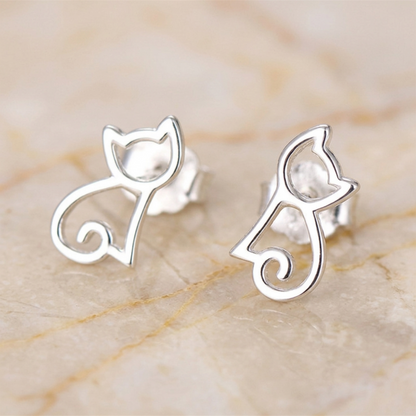 Silver cat-outline stud earrings with cat face and curled tail