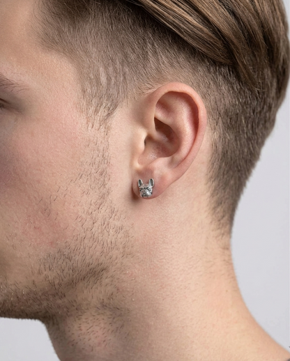 Oxidised bulldog stud earrings on ear, front view of silver-tone dog studs