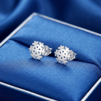 Pair of silver snowflake stud earrings in a gift box