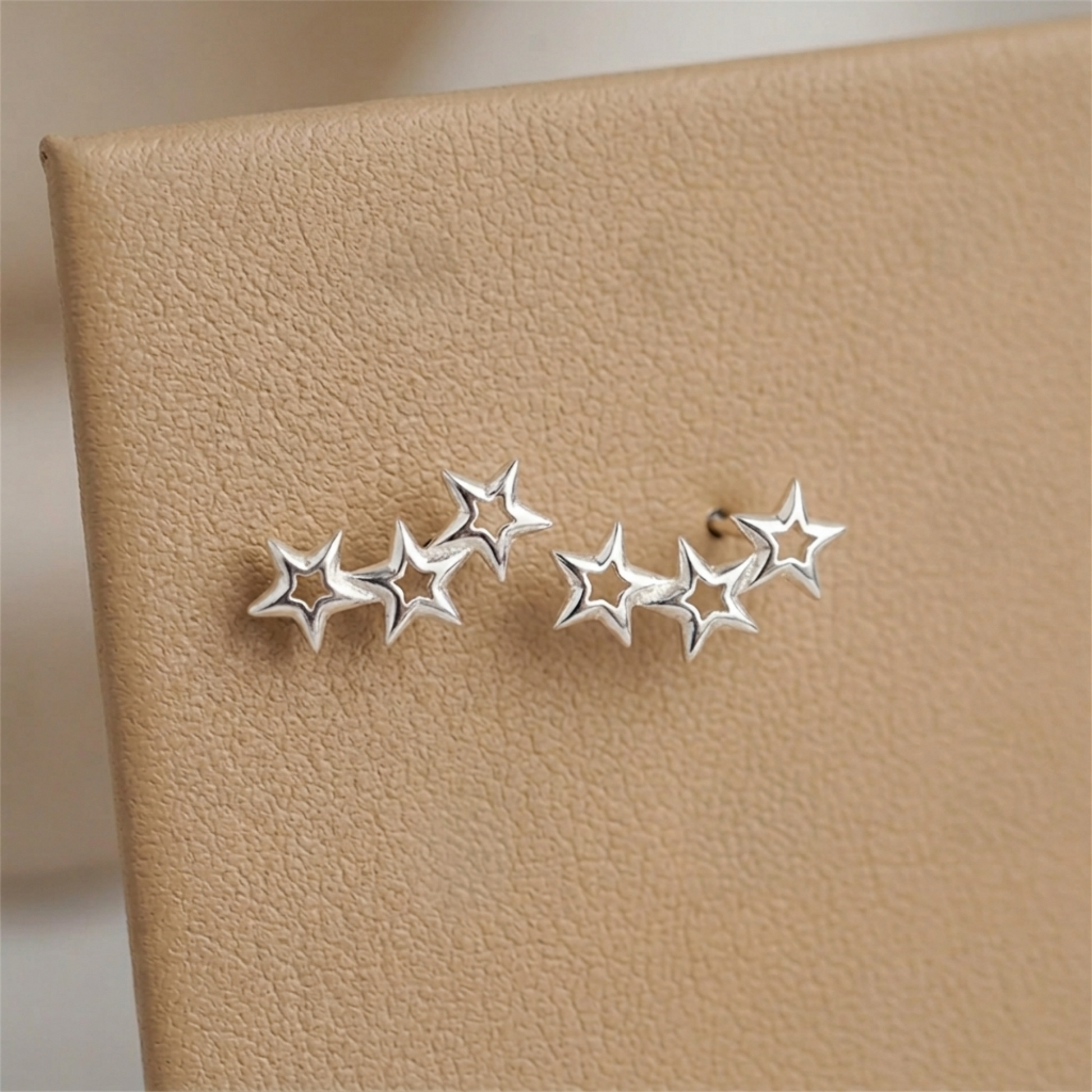 Silver-tone star ear cuff with three connected stars