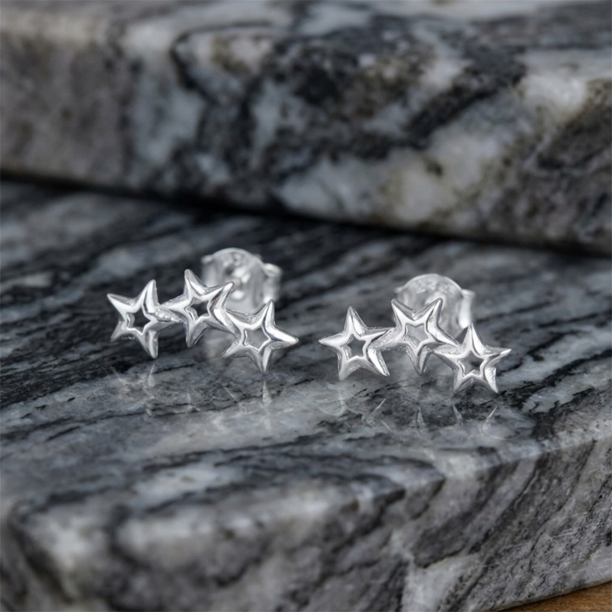 Silver-tone hollow star stud earrings, three connected stars
