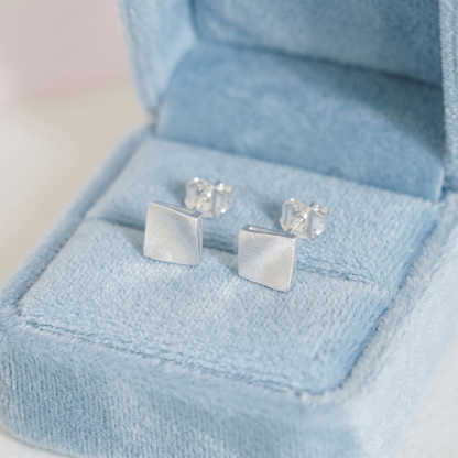 Matte cube stud earrings, brushed silver square studs with butterfly backs.