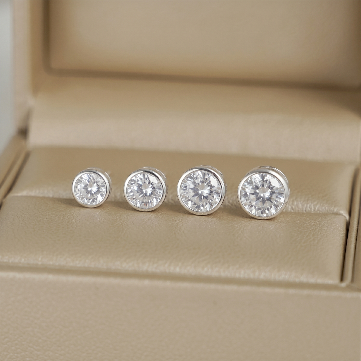 Bezel solitaire stud earrings, round clear gemstone with silver-tone bezel