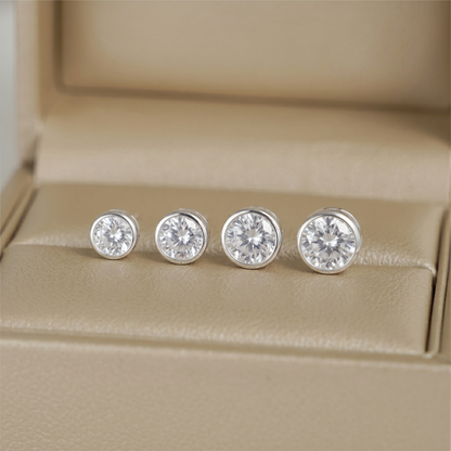 Bezel solitaire stud earrings, round clear gemstone with silver-tone bezel