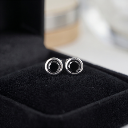 Black bezel solitaire stud earrings, round dark stone with silver-tone edge