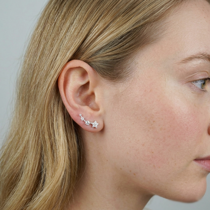 Star CZ ear climbers on model ear, linked mini stars along the ear