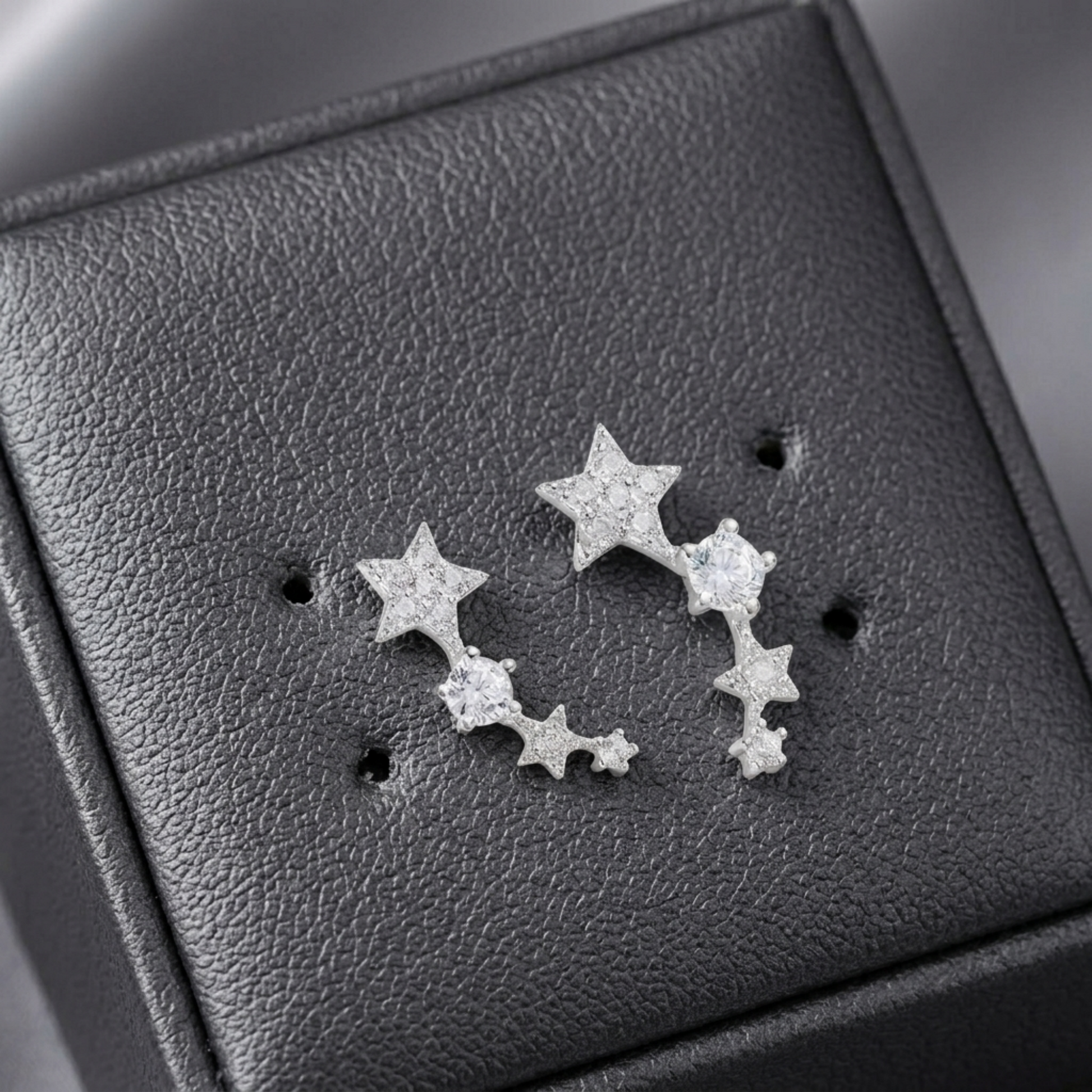 CZ star ear climbers on earring card, three linked stars with small stones
