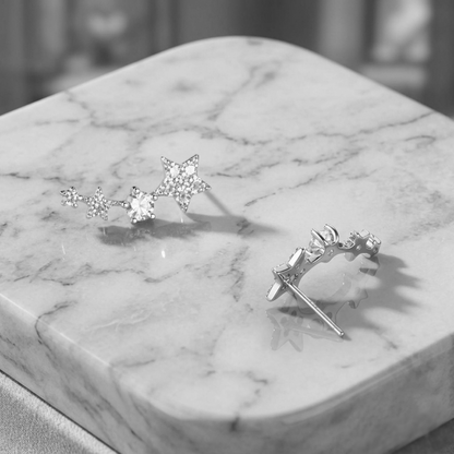 CZ star ear climbers on marble display, linked stars with clustered stones