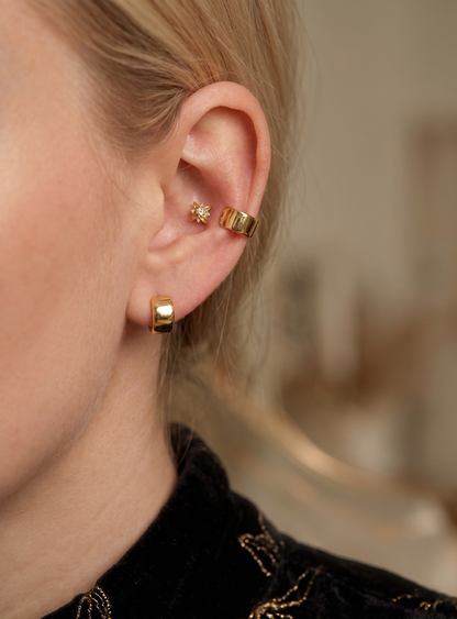 Rose gold 4.5mm hinged hoop earrings on ear