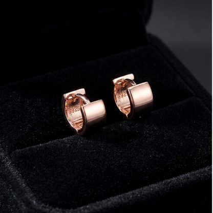 Rose gold 4.5mm sterling silver hoop earrings with hinged clasp, pair shown.