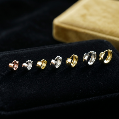 Lineup of 4.5mm sterling hoop earrings in mixed finishes: rose, silver, gold